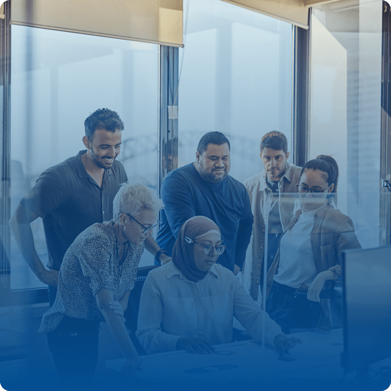 Group of people collaborating in office setting.